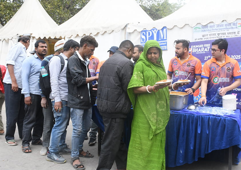 Children smiling with plates in hand
